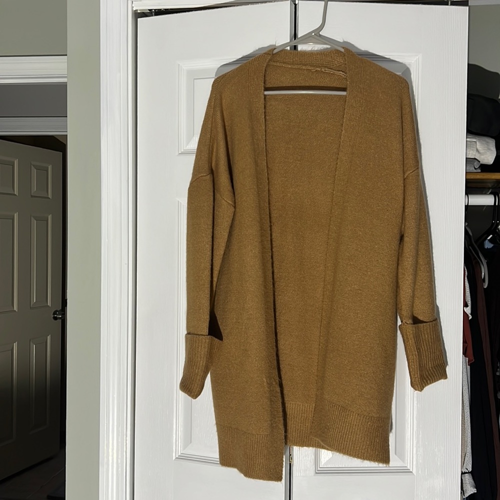Long coffee colored cardigan. Barely worn. Looks cute with light jeans!
